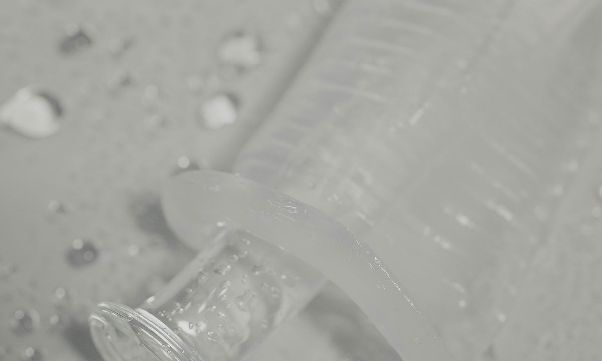 HydroSlix™ Vaginal Liner on a light green background with water droplets